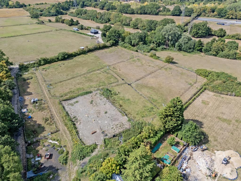 Lot: 72 - VACANT LAND IN VILLAGE LOCATION - Aerial drone shot of the land
